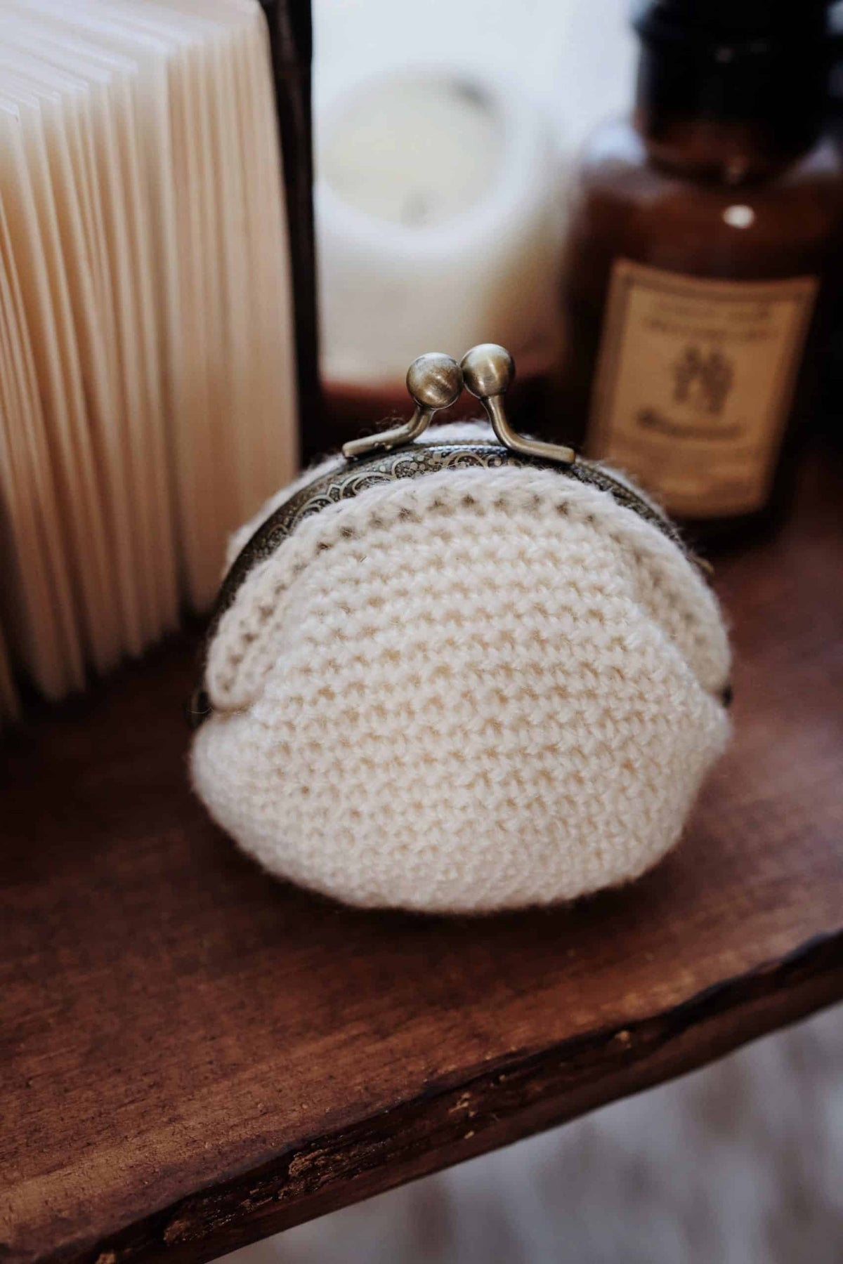 Classic crochet coin purse pattern showing elegant vintage clasp and textured stitching