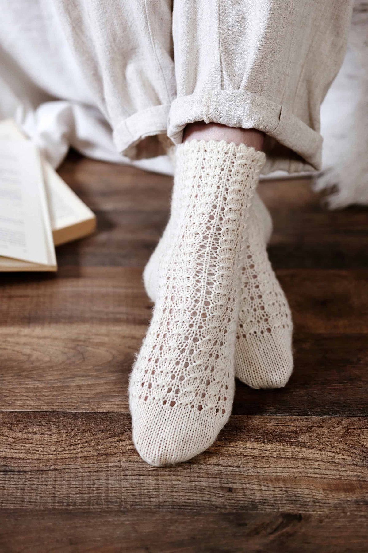 Beautiful rosehip lace socks pattern with delicate openwork design
