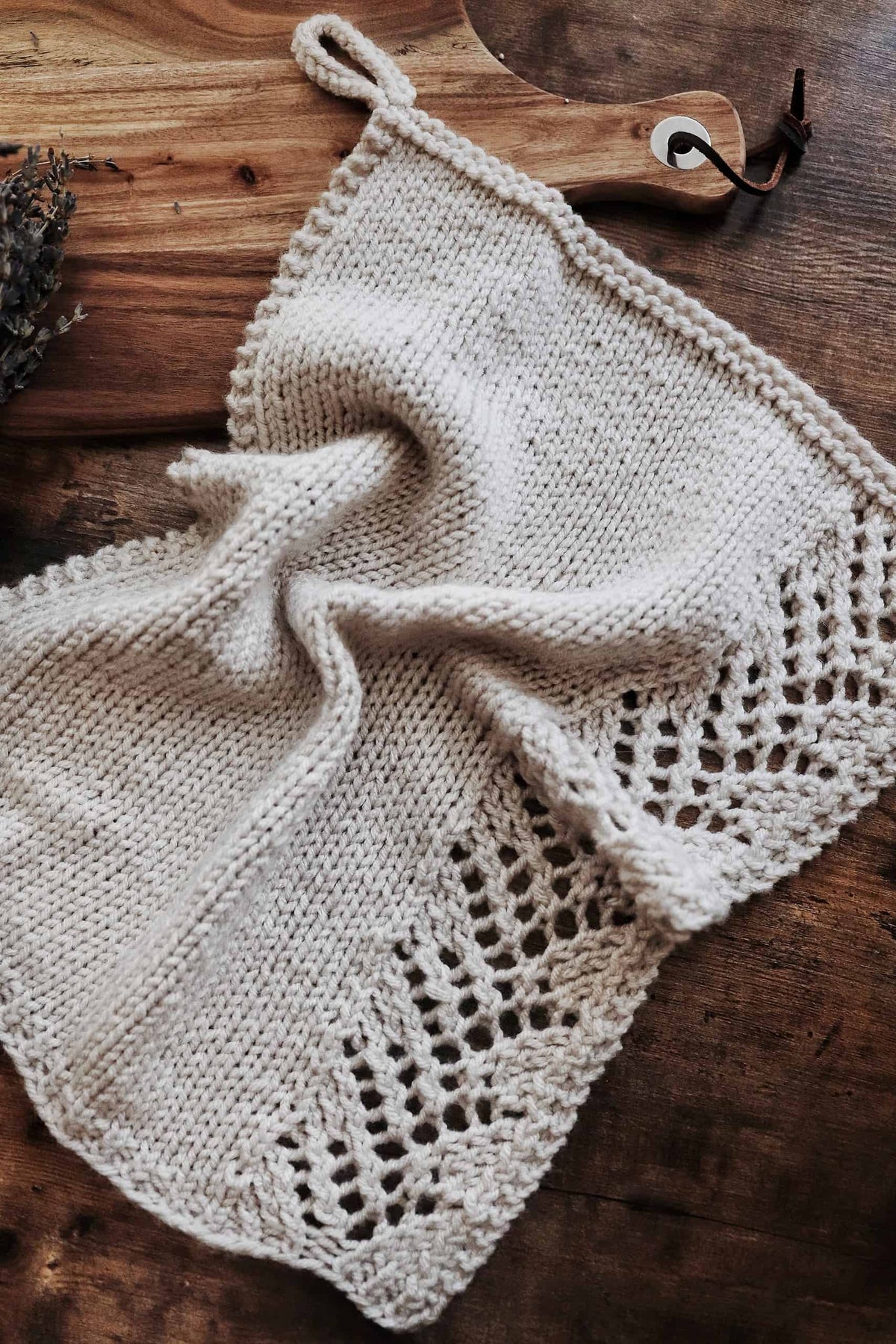Handknit tea towel with delicate lace border in neutral farmhouse kitchen