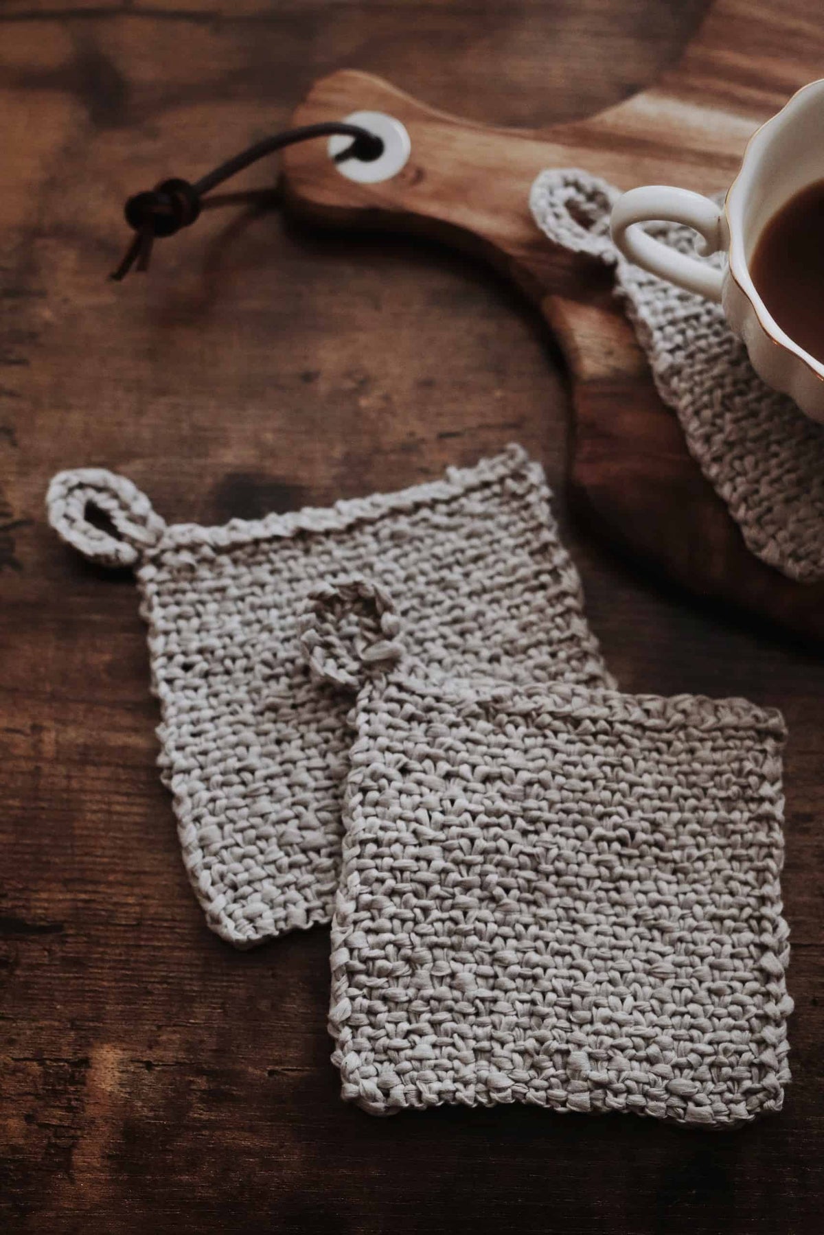 Close up of woven coaster knitting pattern texture detail in cream colored yarn