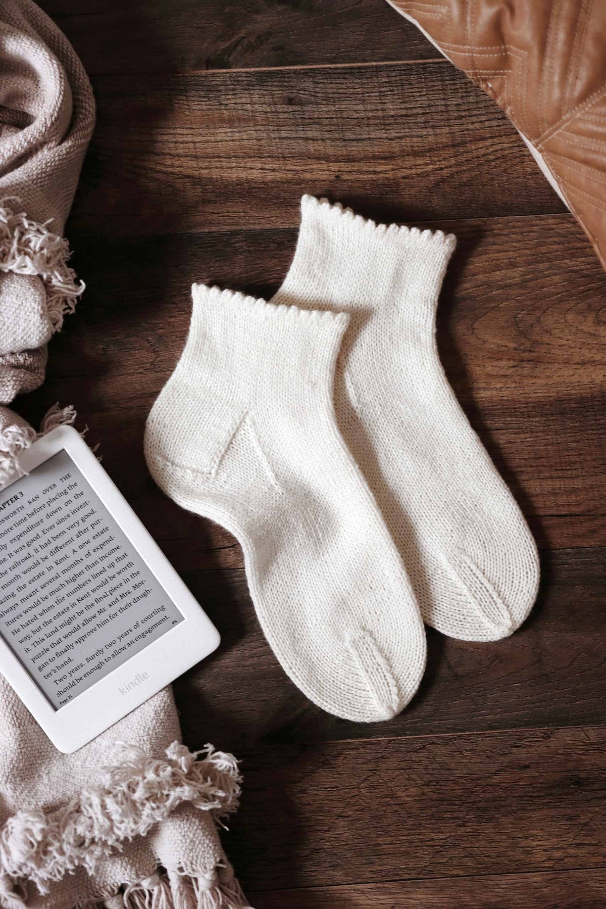Handmade knit socks with classic stockinette stitch and ruffle trim