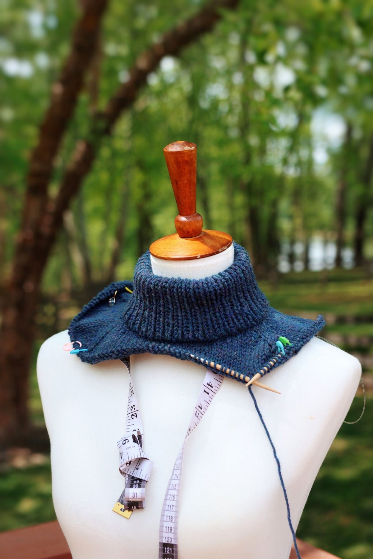 Person wearing a cozy navy sweater.