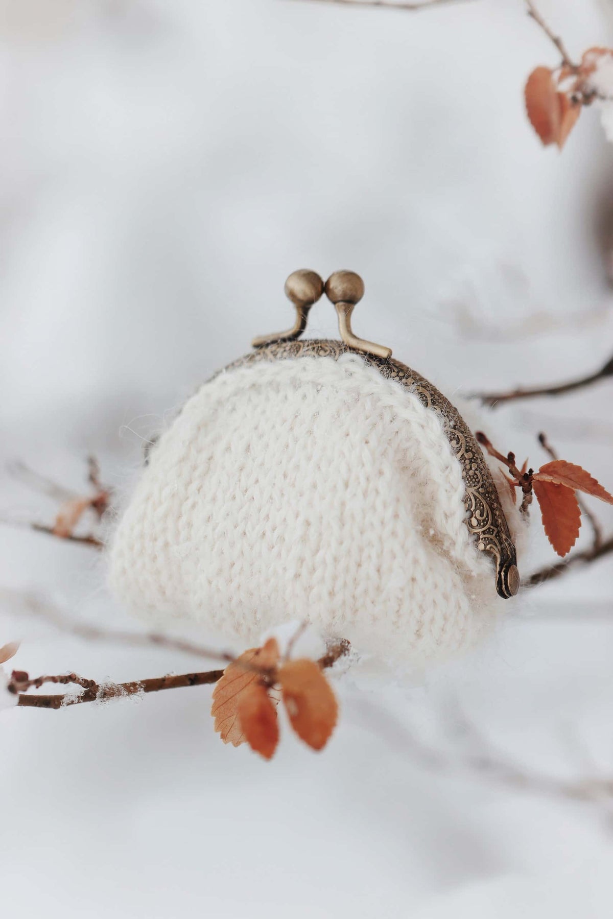Classic knitted coin pouch pattern detail showing sophisticated stitch work