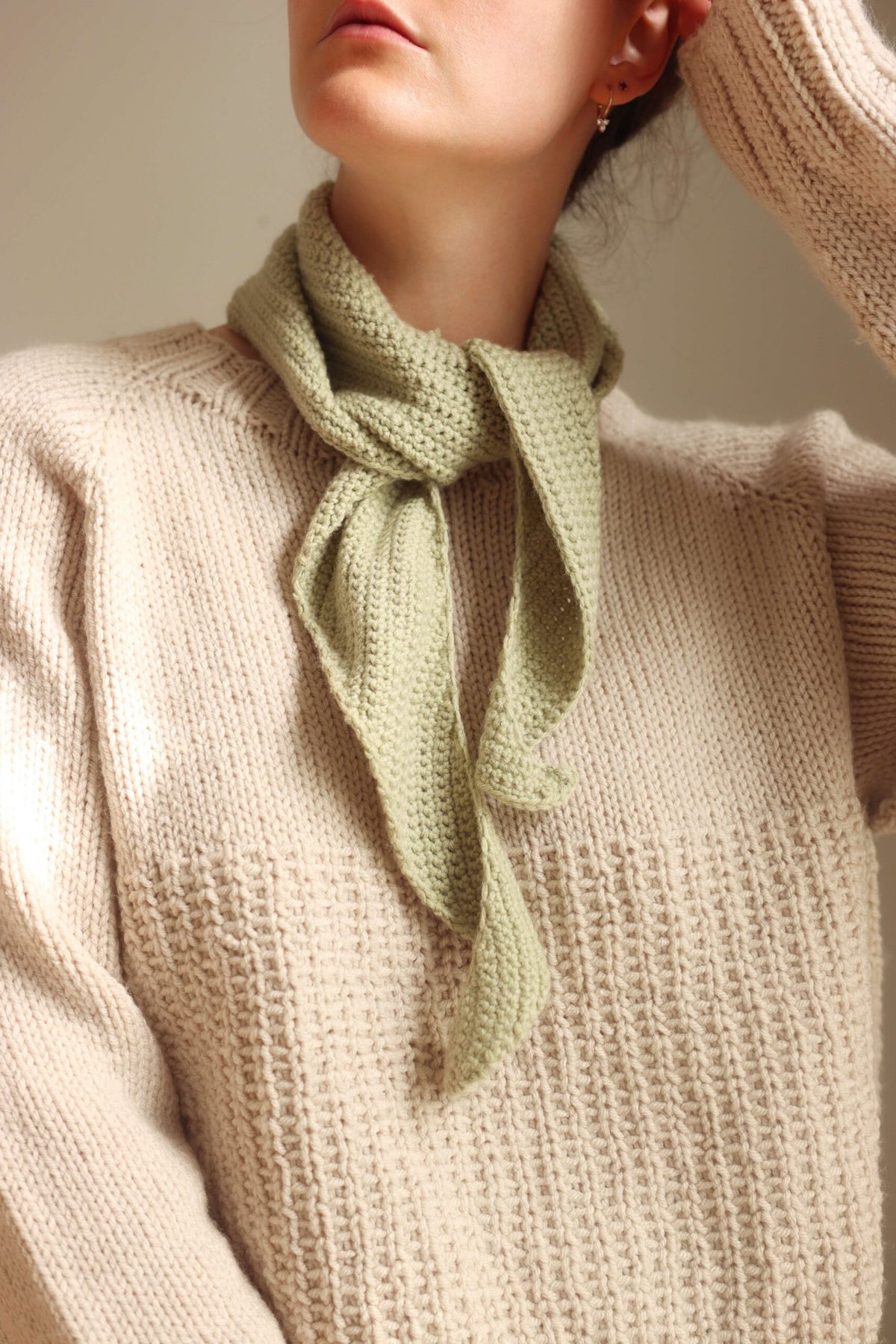 Sage green crochet neck scarf with a cream sweater - The Saturday Scarf Crochet Pattern by Darling Jadore