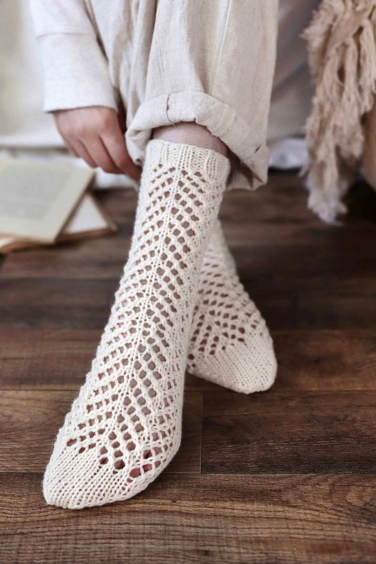 Seabrook lace socks knitting pattern with arrowhead lace detail on ankle