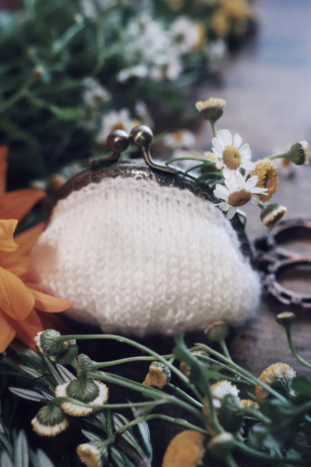 Beginner-friendly coin purse knitting pattern styled with timeless aesthetic