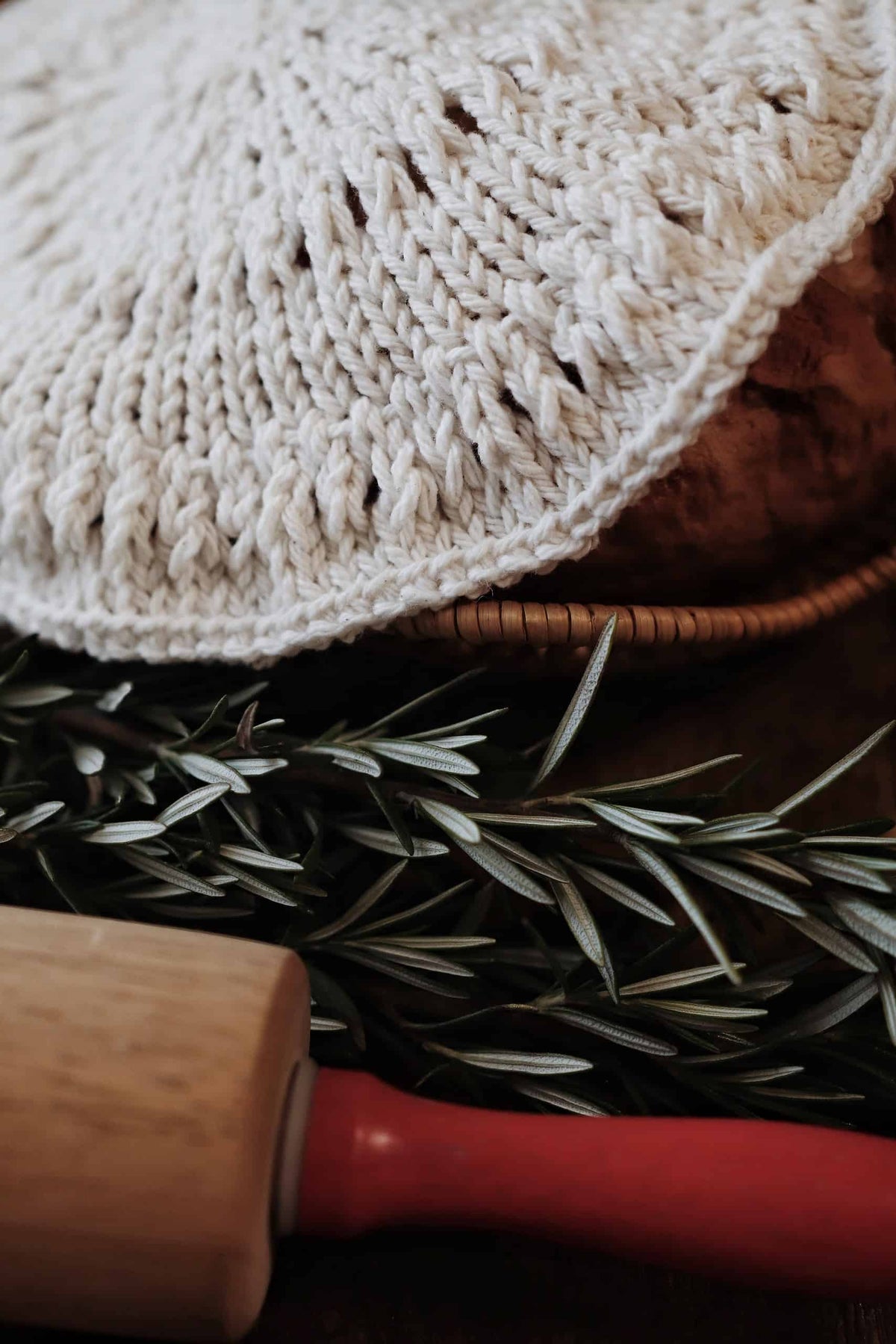 Dusk bread cover knitting pattern styled with fresh baked bread in cozy kitchen setting