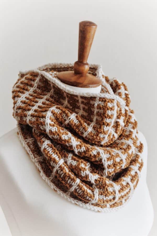 Close-up of mosaic knit cowl pattern showing textured colorwork detail