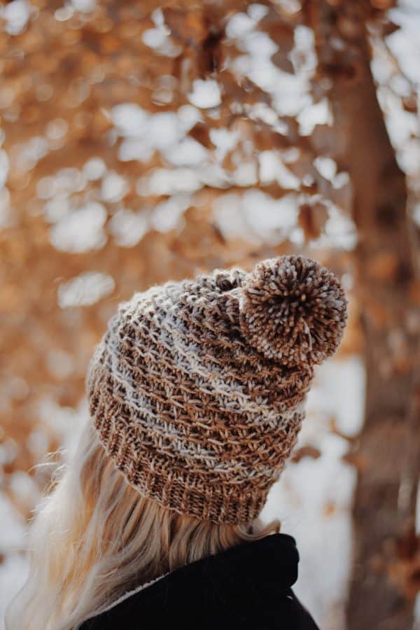 Side view of textured beanie knitting pattern with prominent ribbed brim