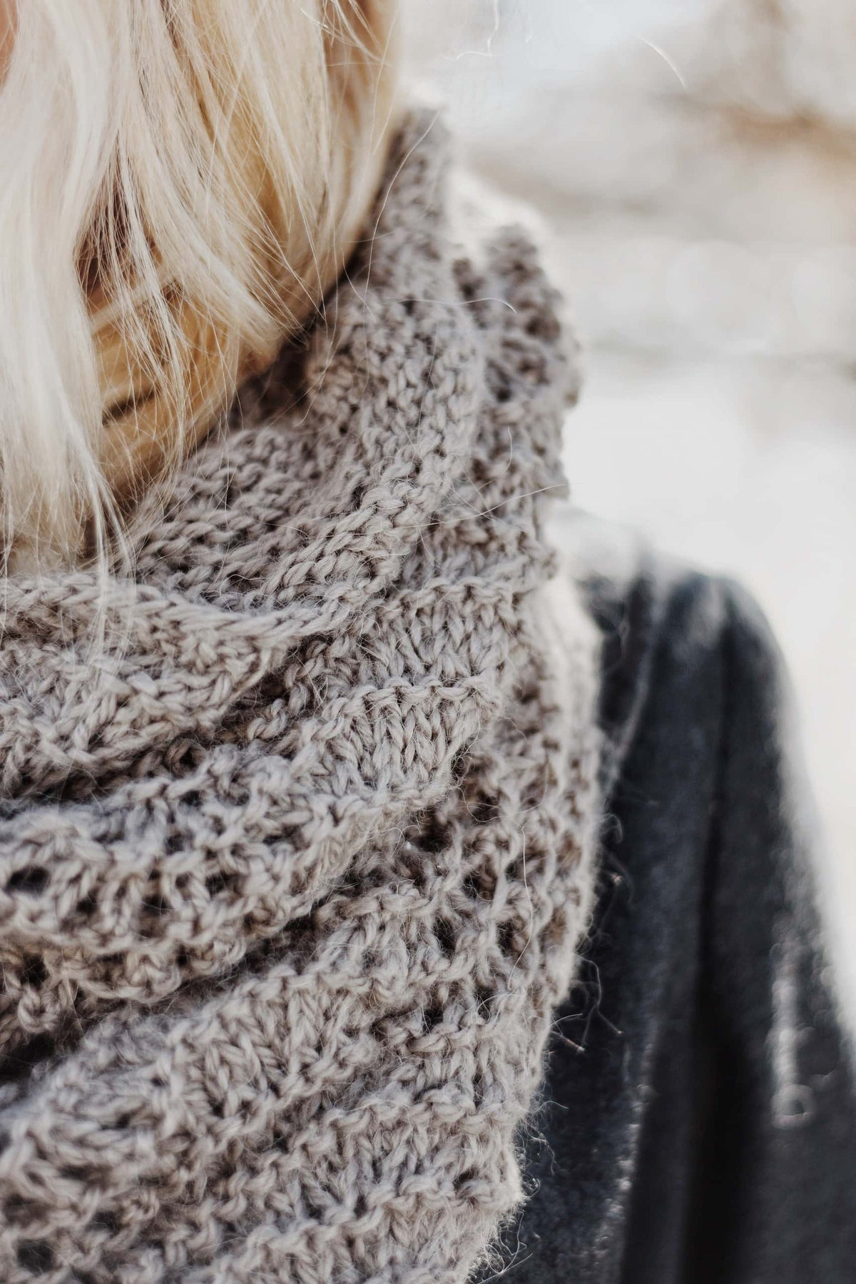 Beginner-friendly lace cowl pattern with fan and feather stitch in natural light