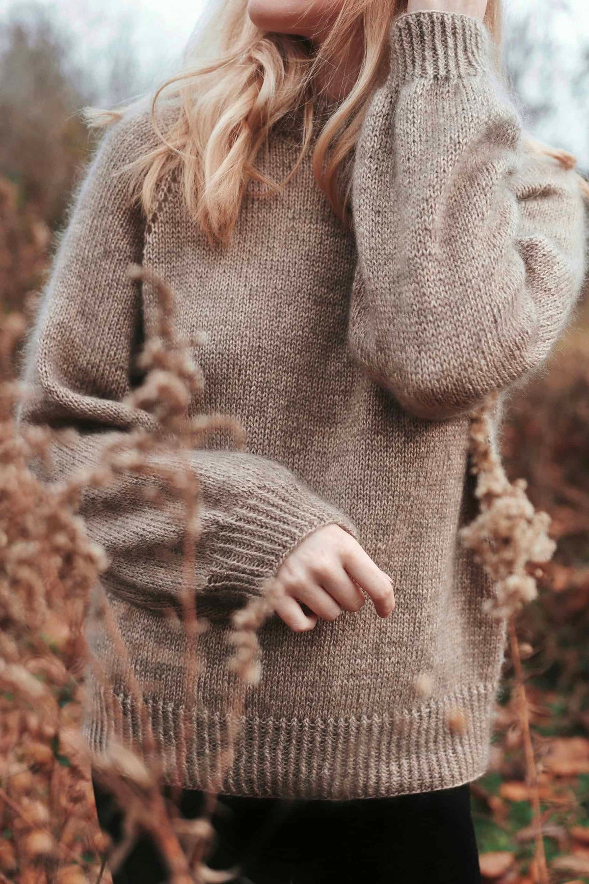 Detail of eyelet lace raglan stitches on elegant Café Sweater knitting pattern