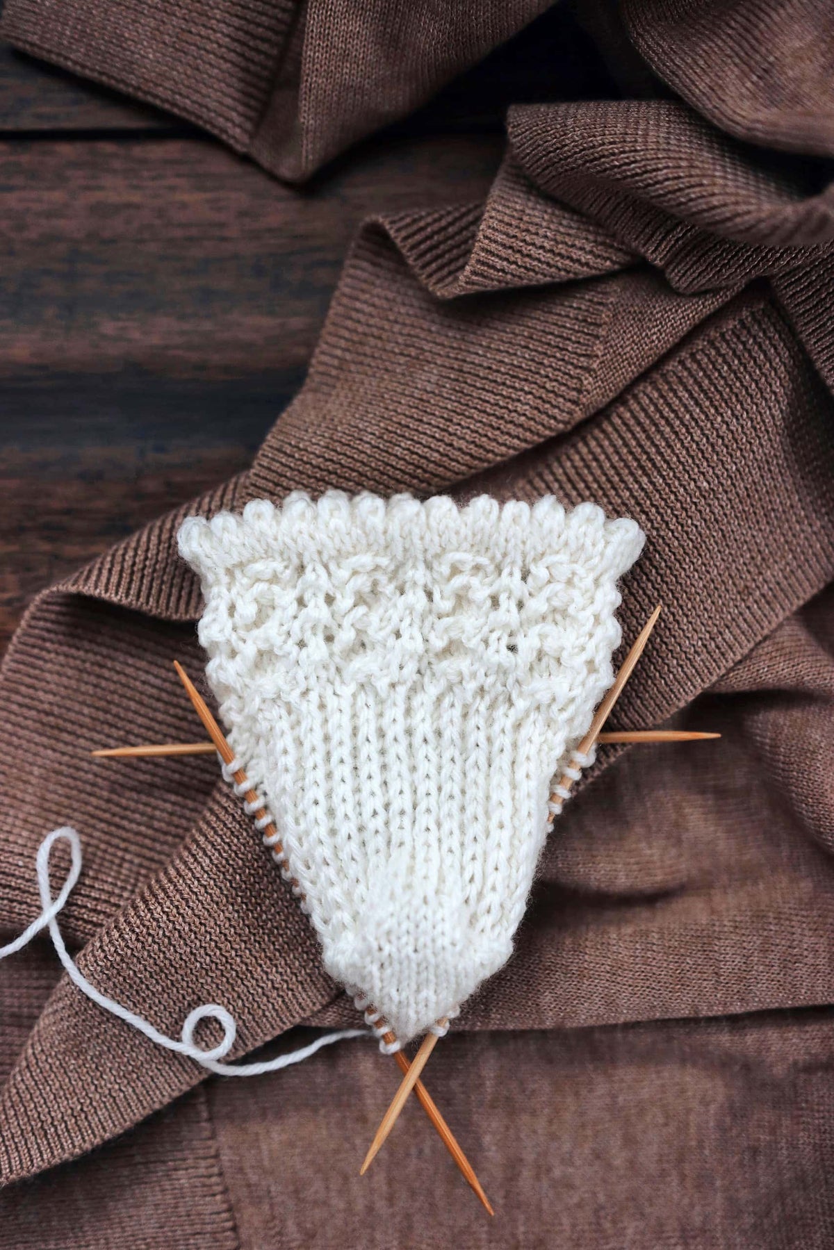 Textured lace socks knitting pattern modeled showing full leg and foot detail