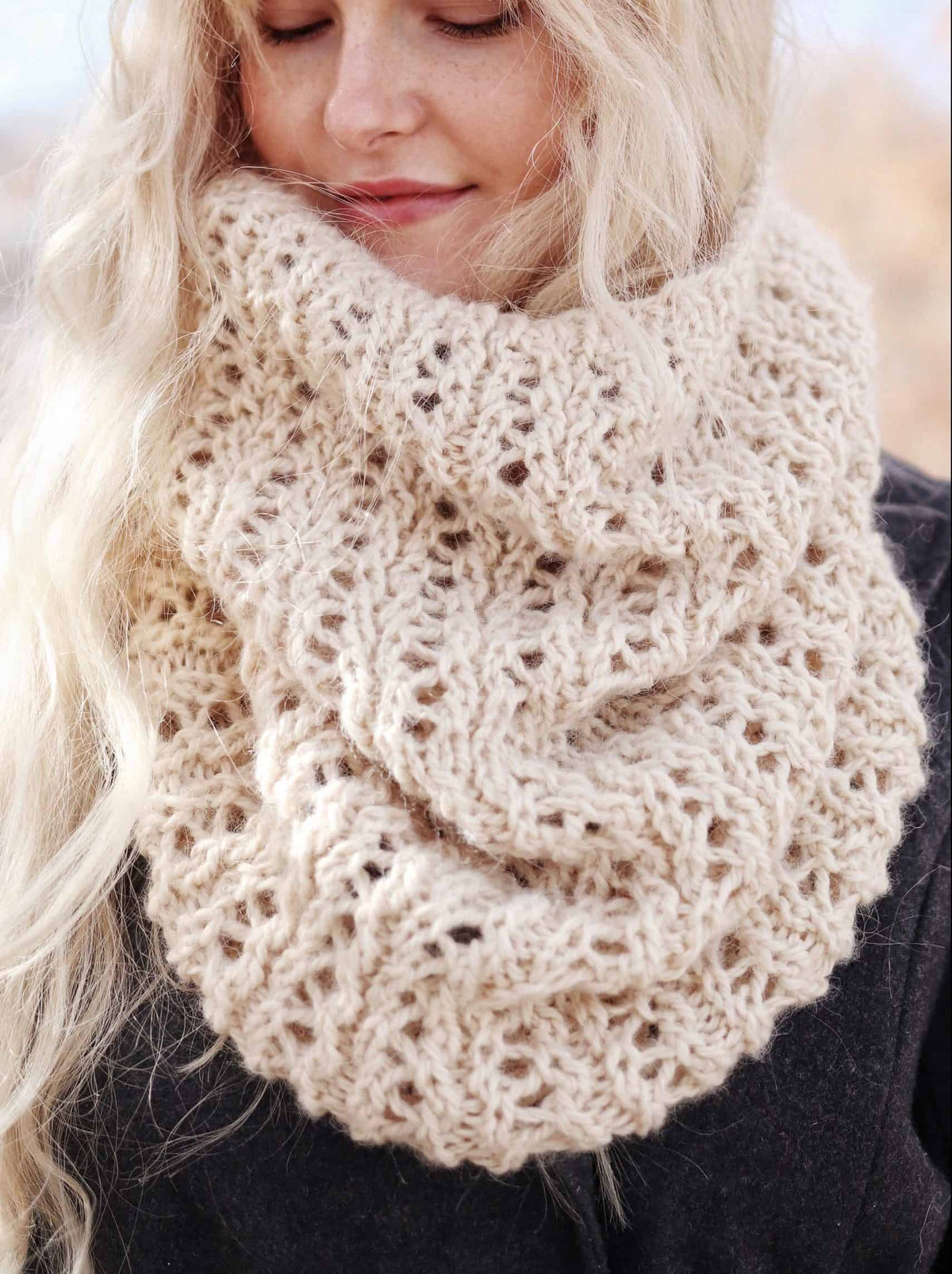 Side view of elegant lace cowl knitting pattern draped naturally showing flowing texture