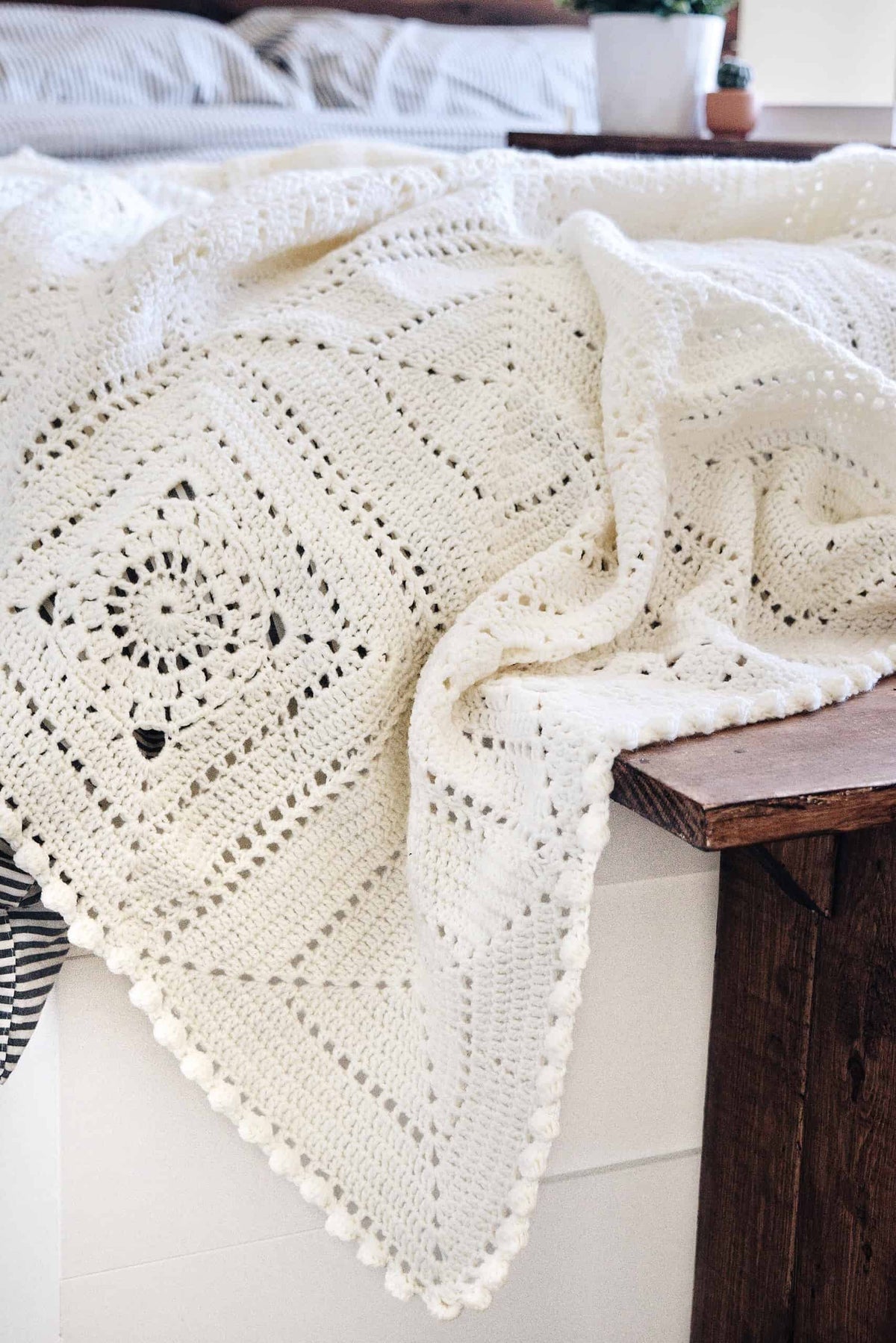 Close-up of Honeymilk throw crochet pattern featuring intricate granny square design with bobble stitches