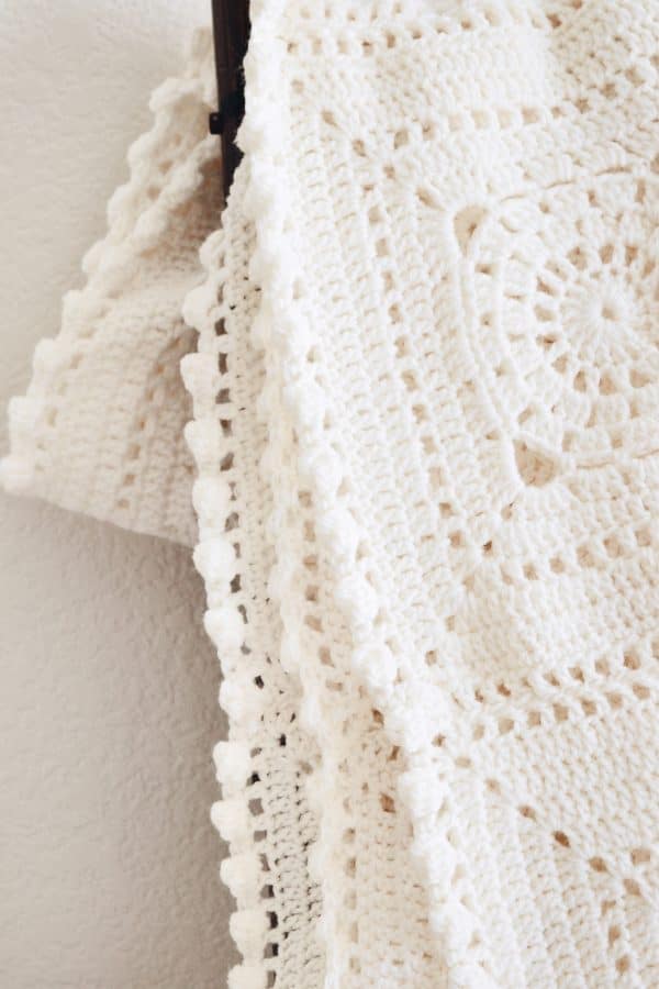Heirloom granny square afghan pattern with elegant bobble and lace stitch combination