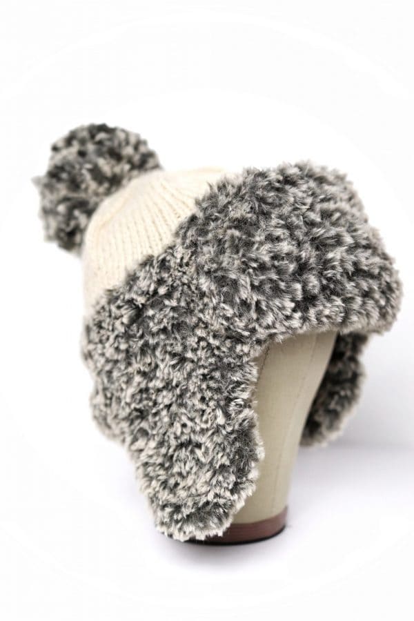 Side view of luxurious faux fur earflap hat knitting pattern - The Tundra Hat winter beanie