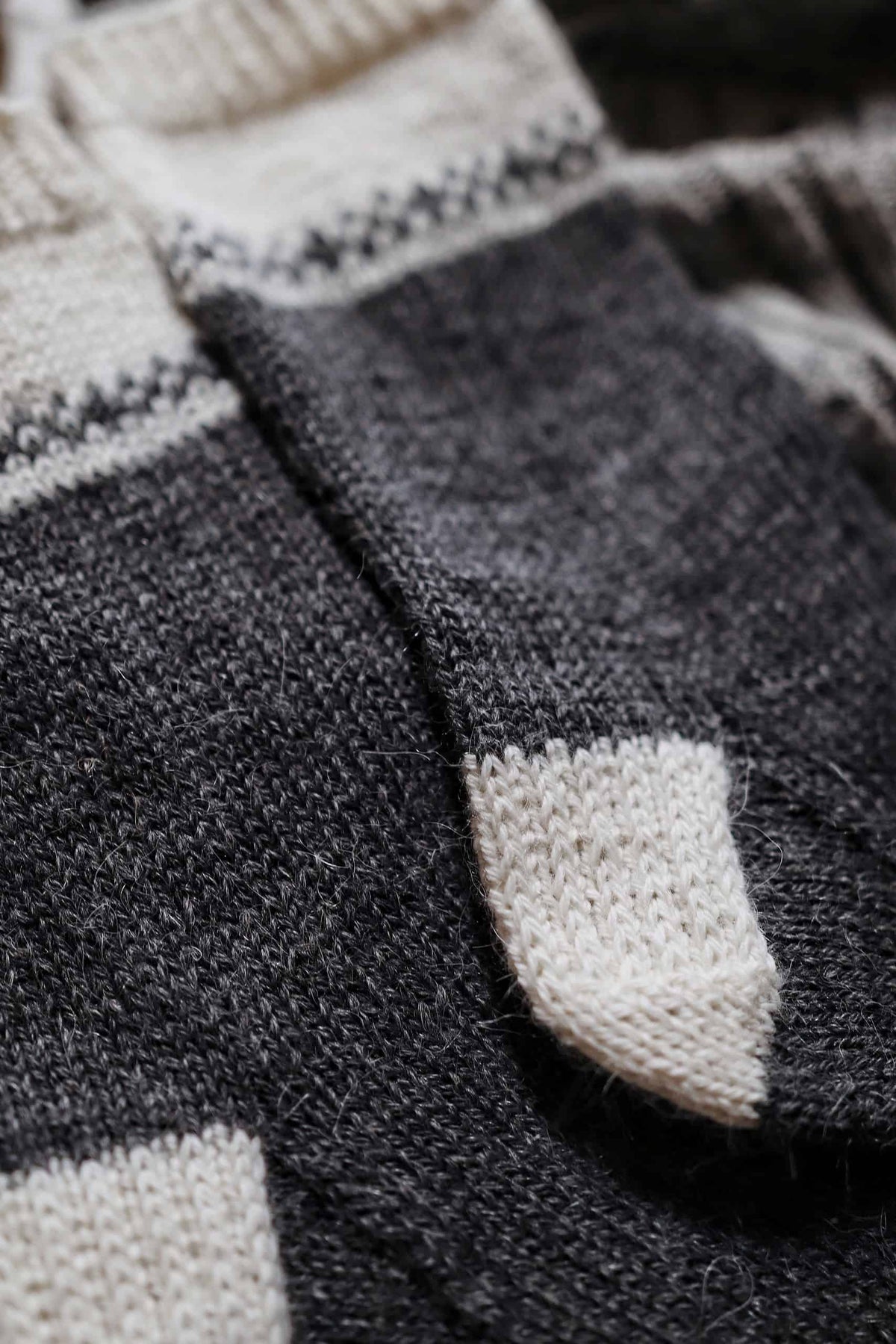 Side view of hand knit Fair Isle socks with stockinette stitch and stranded colorwork