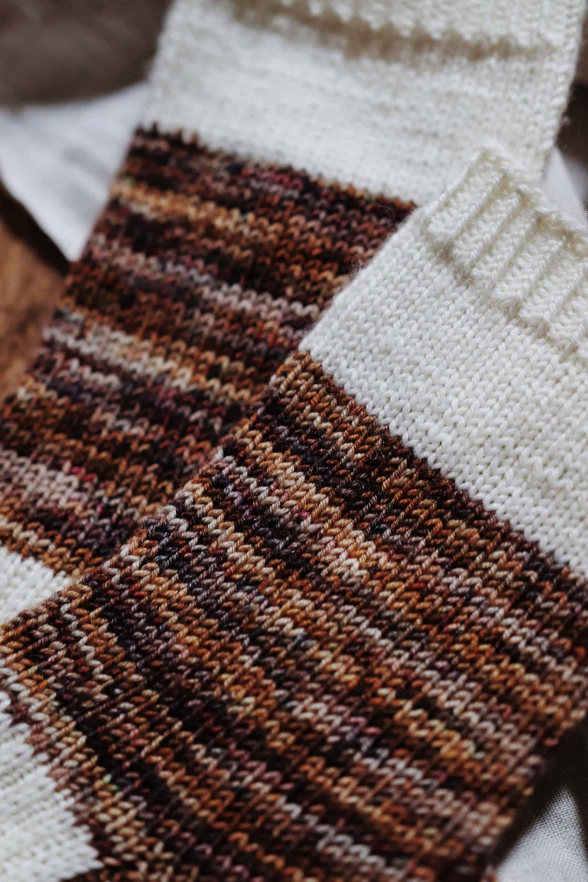 Handmade Sandstone Socks knitting pattern featuring two-toned design with speckled yarn