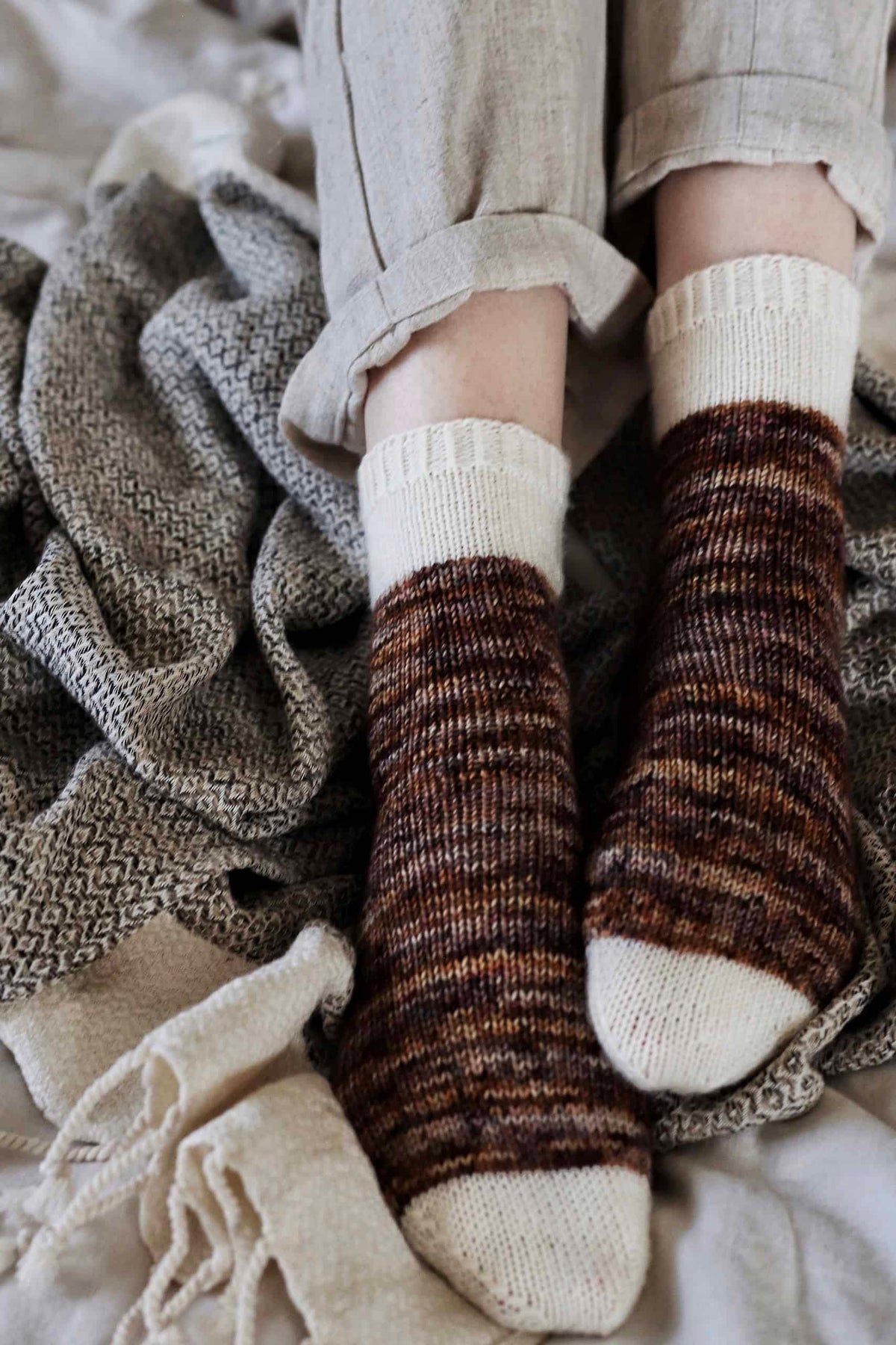 Close-up of Sandstone Socks showing classic knit stitch texture and color transition