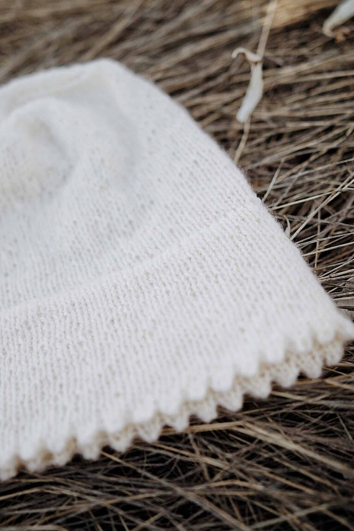 Close up of Icicle Beanie showing delicate picot edging and stockinette texture