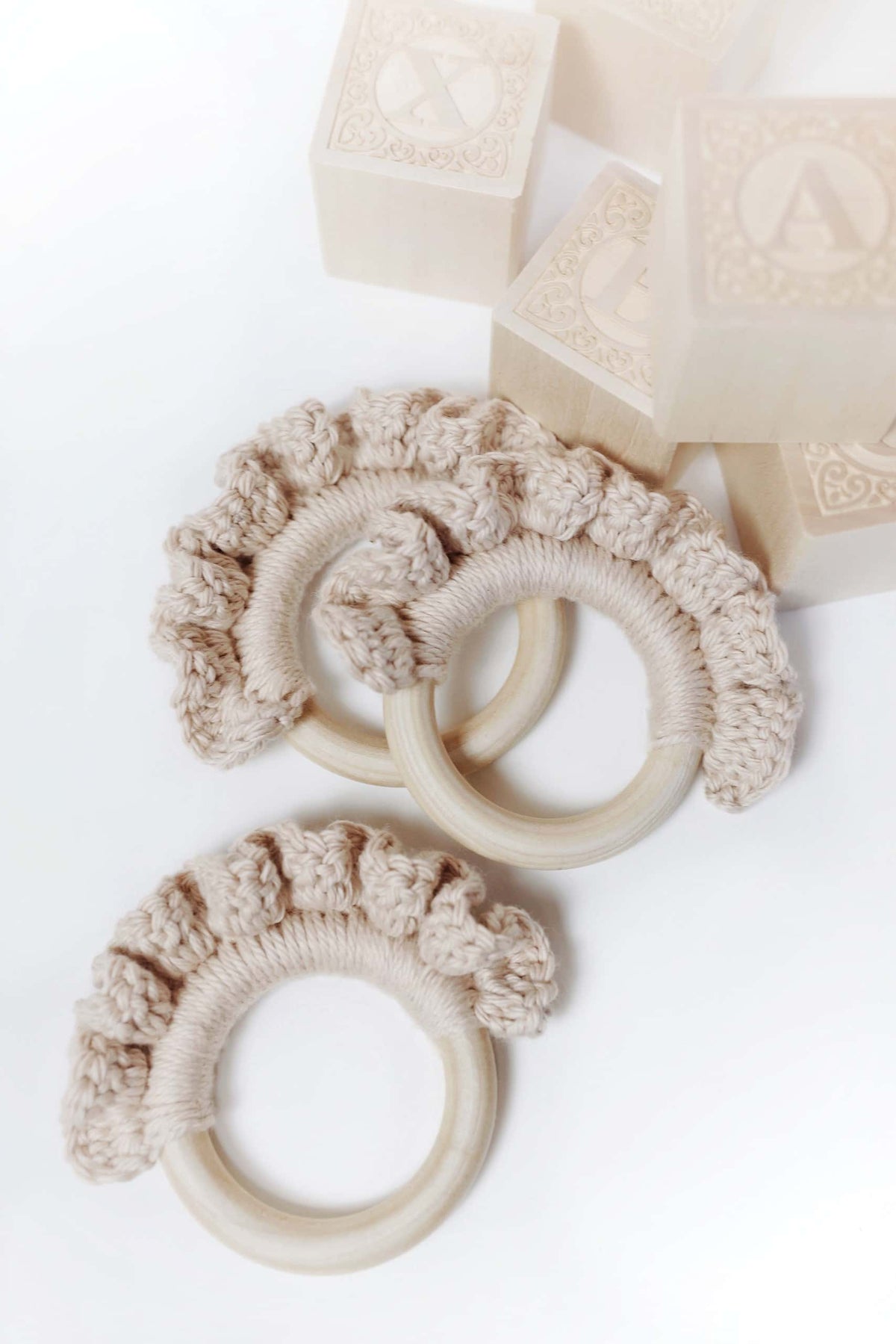 Close up of Lil Waves teether crochet pattern showing textured wave stitch detail