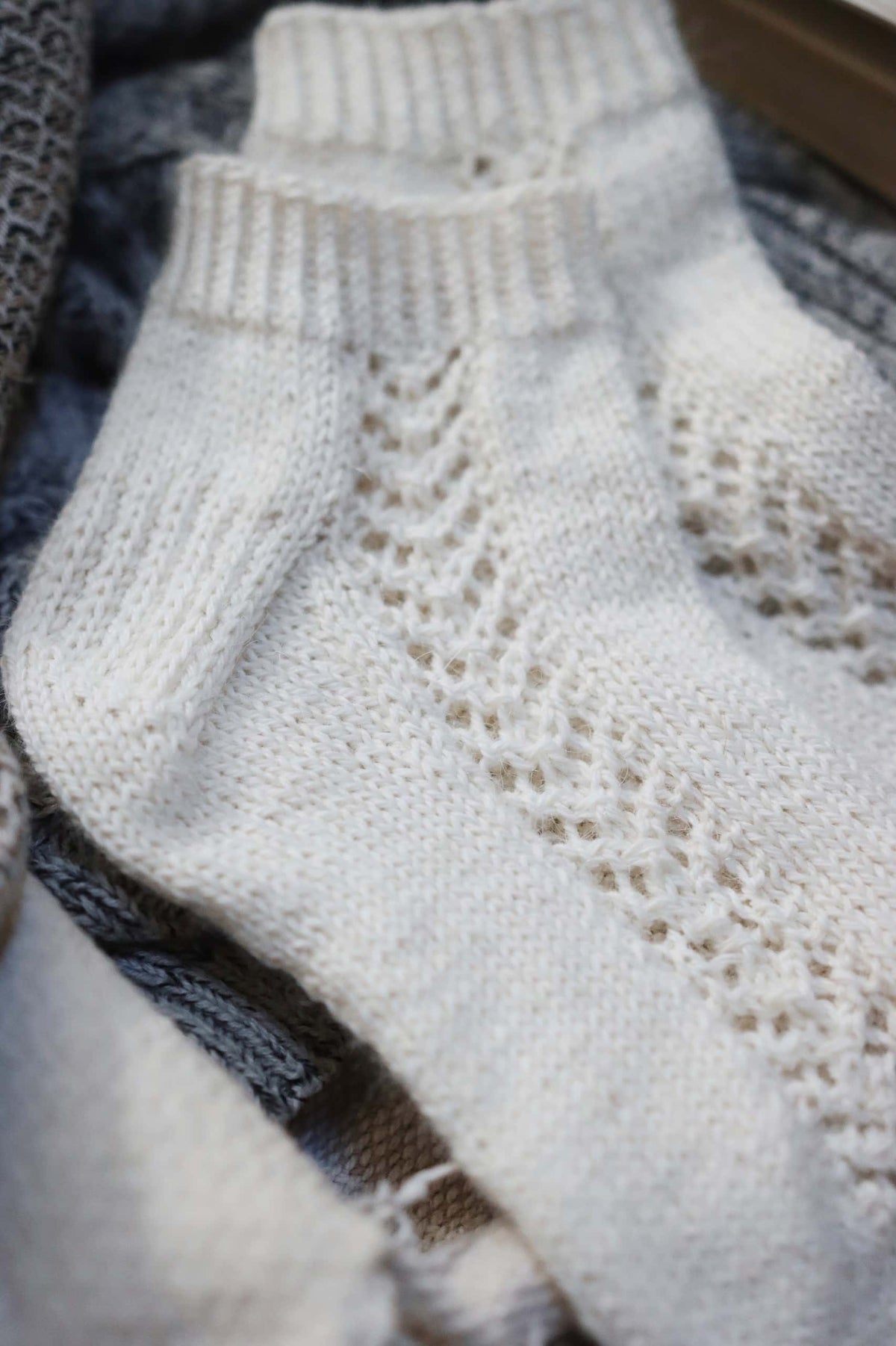 Close up of Gardenia socks lace knitting pattern showing classic sock construction