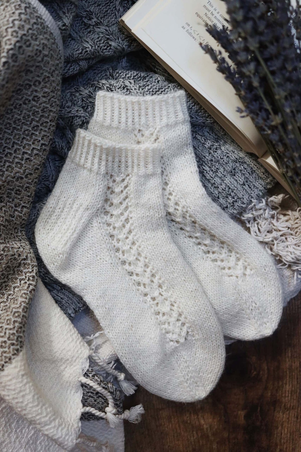 Gardenia lace socks knitting pattern showing elegant cascading lace panel detail on ankle