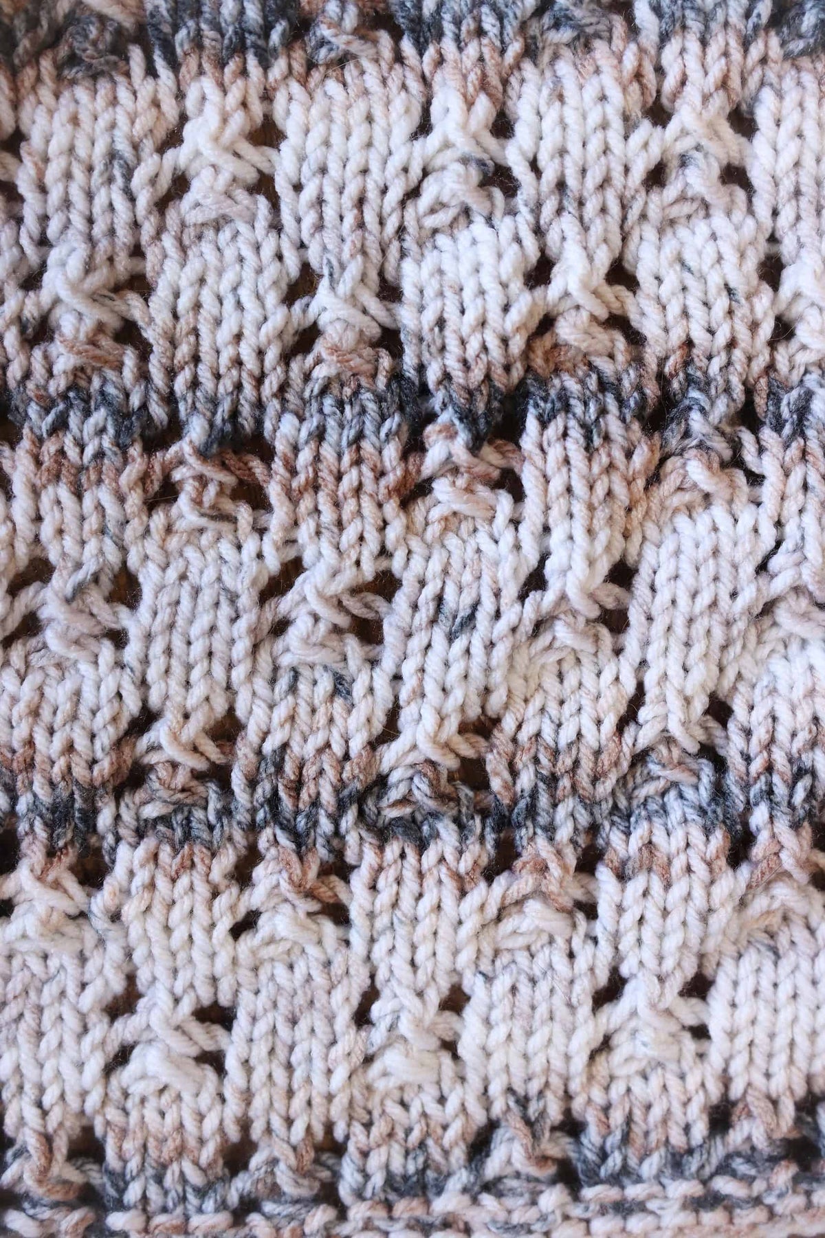 Hand-knit lace tea towel pattern displayed flat showing full length and decorative stitch work