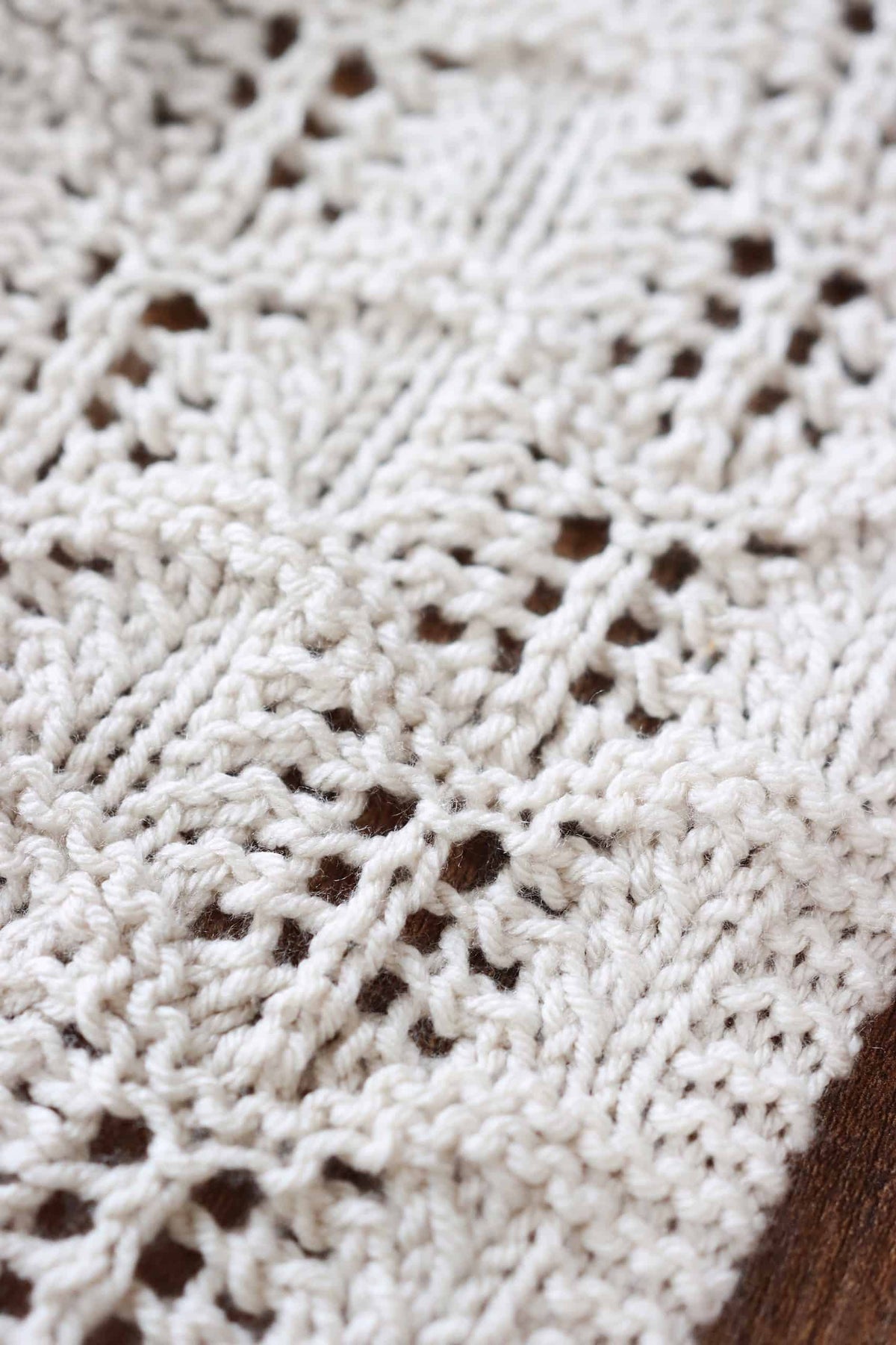 Close up detail of lace tea towel knitting pattern showing garter and stockinette texture