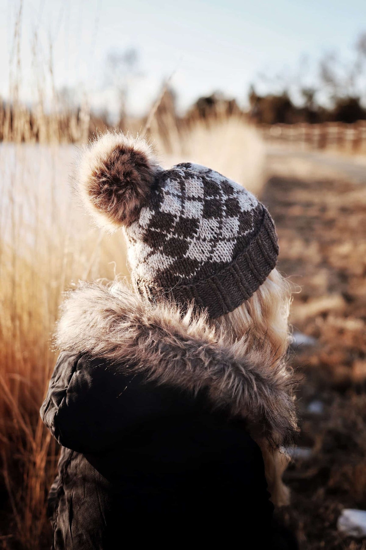 Model wearing The Cypress Beanie showing cozy fold-over brim and vintage argyle pattern