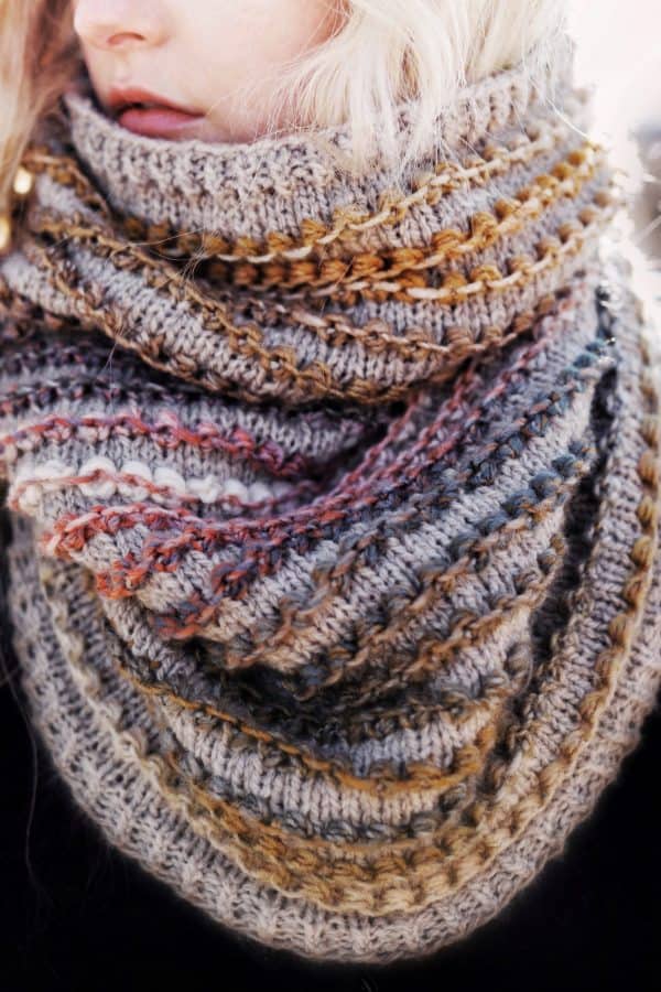 The Rosewood Cowl knitting pattern with textured bobble details and ribbed edges in neutral tones