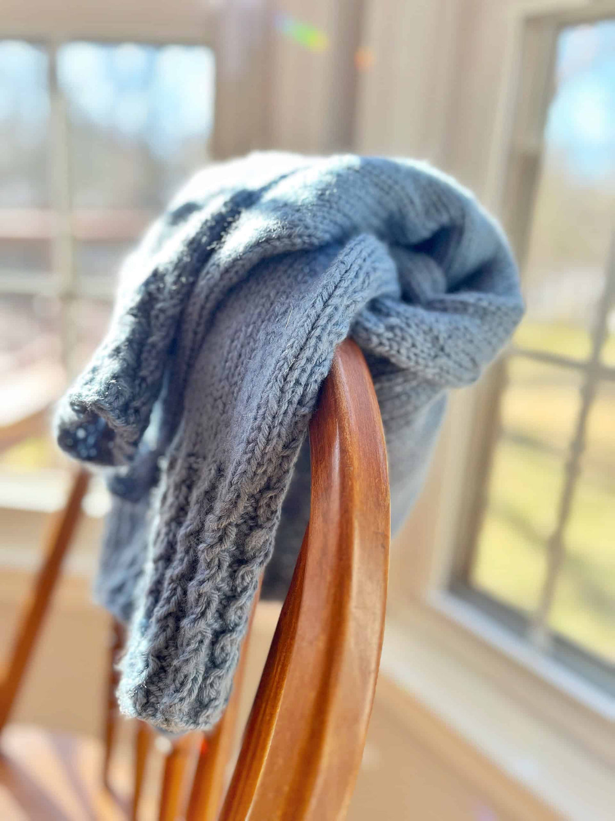 Mistfall Sweater knitting pattern styled with minimalist aesthetic in natural light