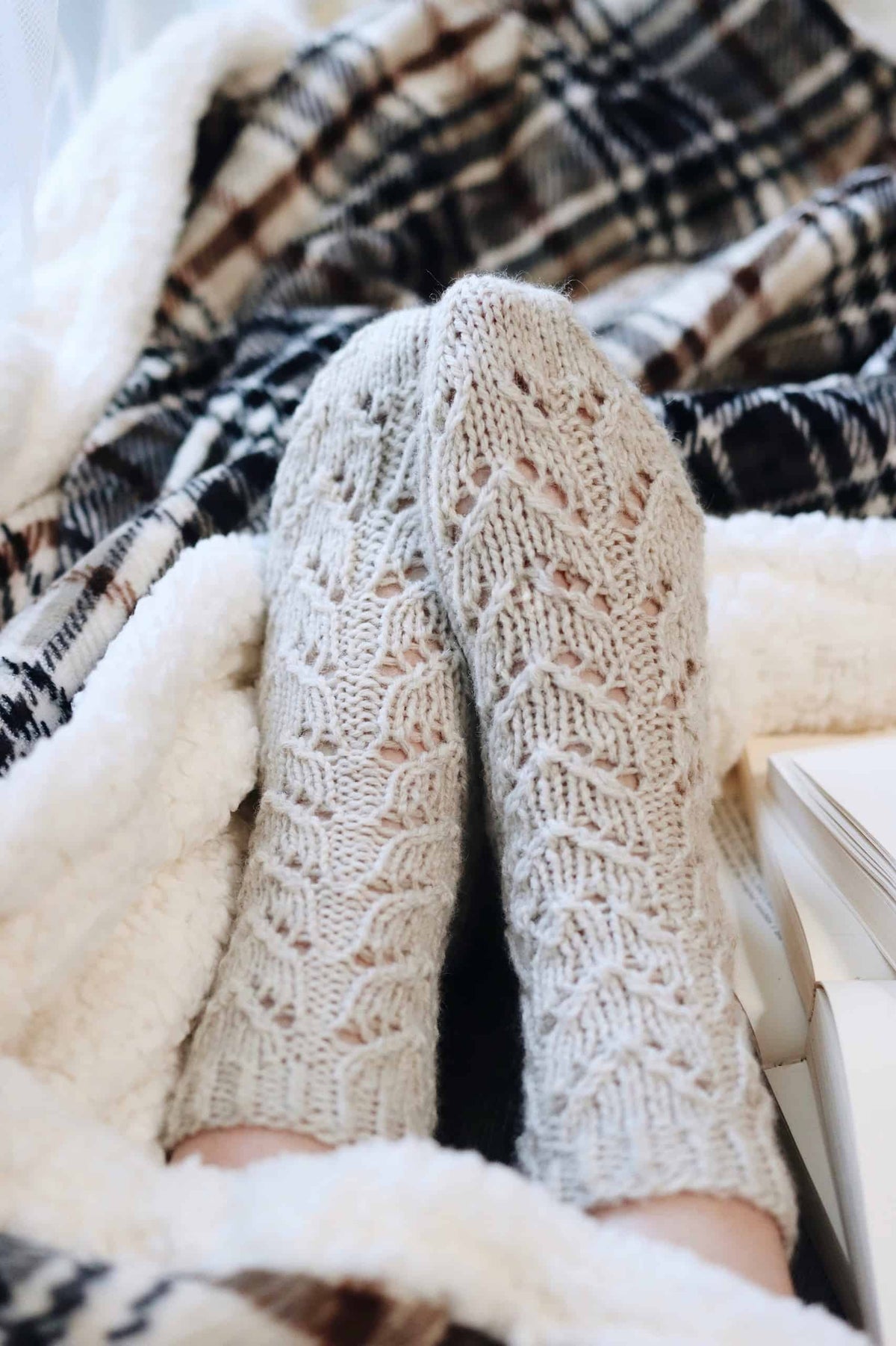 Alpine socks pattern showing romantic lace knit details perfect for intermediate knitters