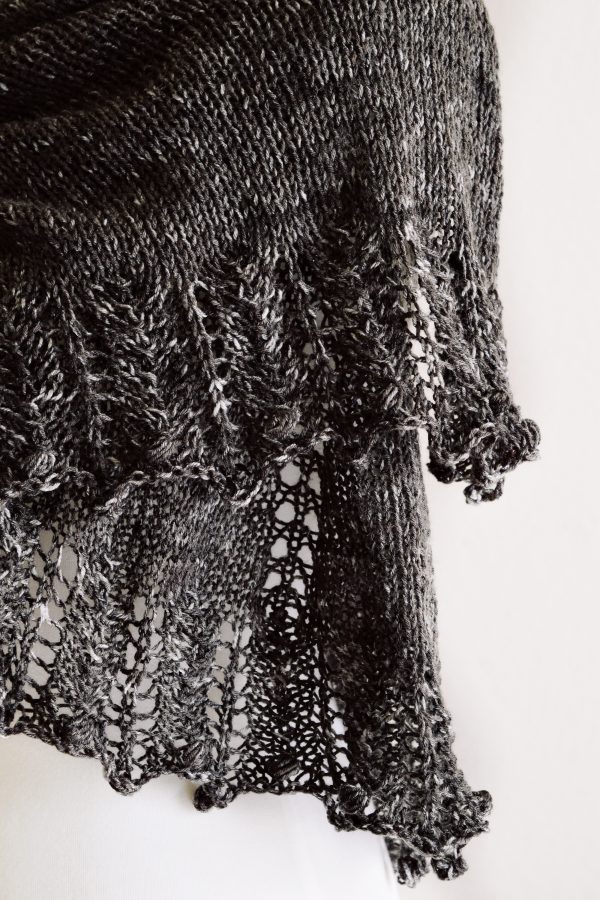 Cream crescent shawl draped over shoulders showing delicate lace edge detail - knitting pattern by Darling Jadore