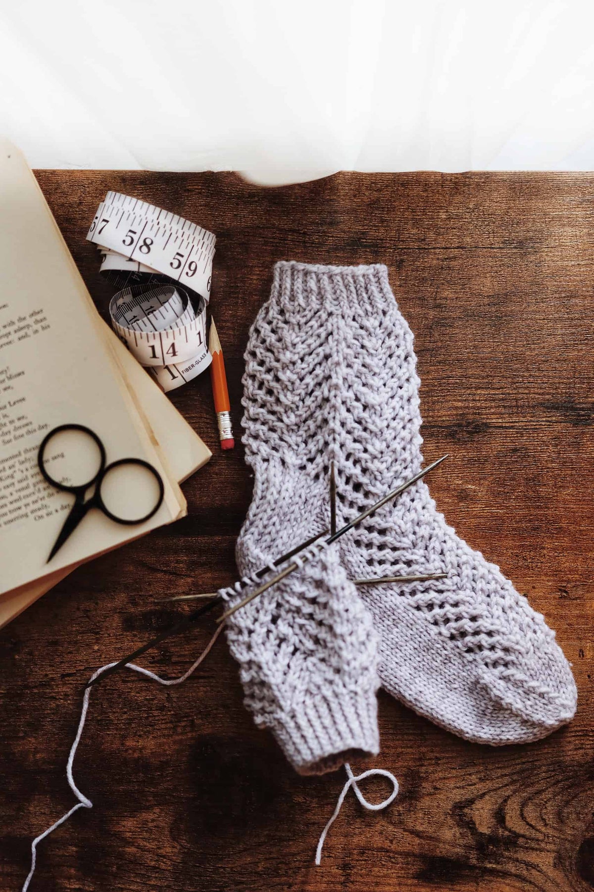 Close up of arrowhead lace pattern on handknit Seabrook socks