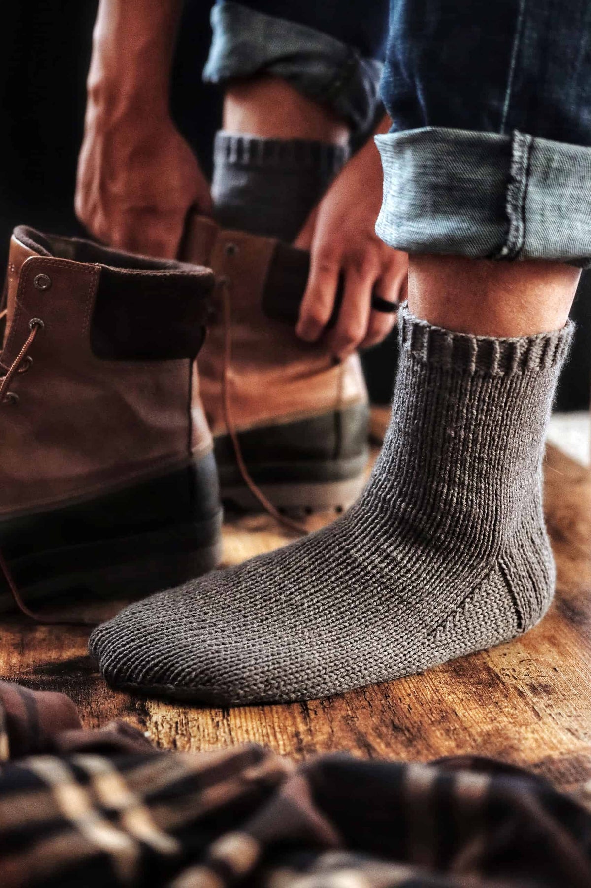Hand knit boyfriend socks in cream yarn worn with boots - DK weight sock knitting pattern