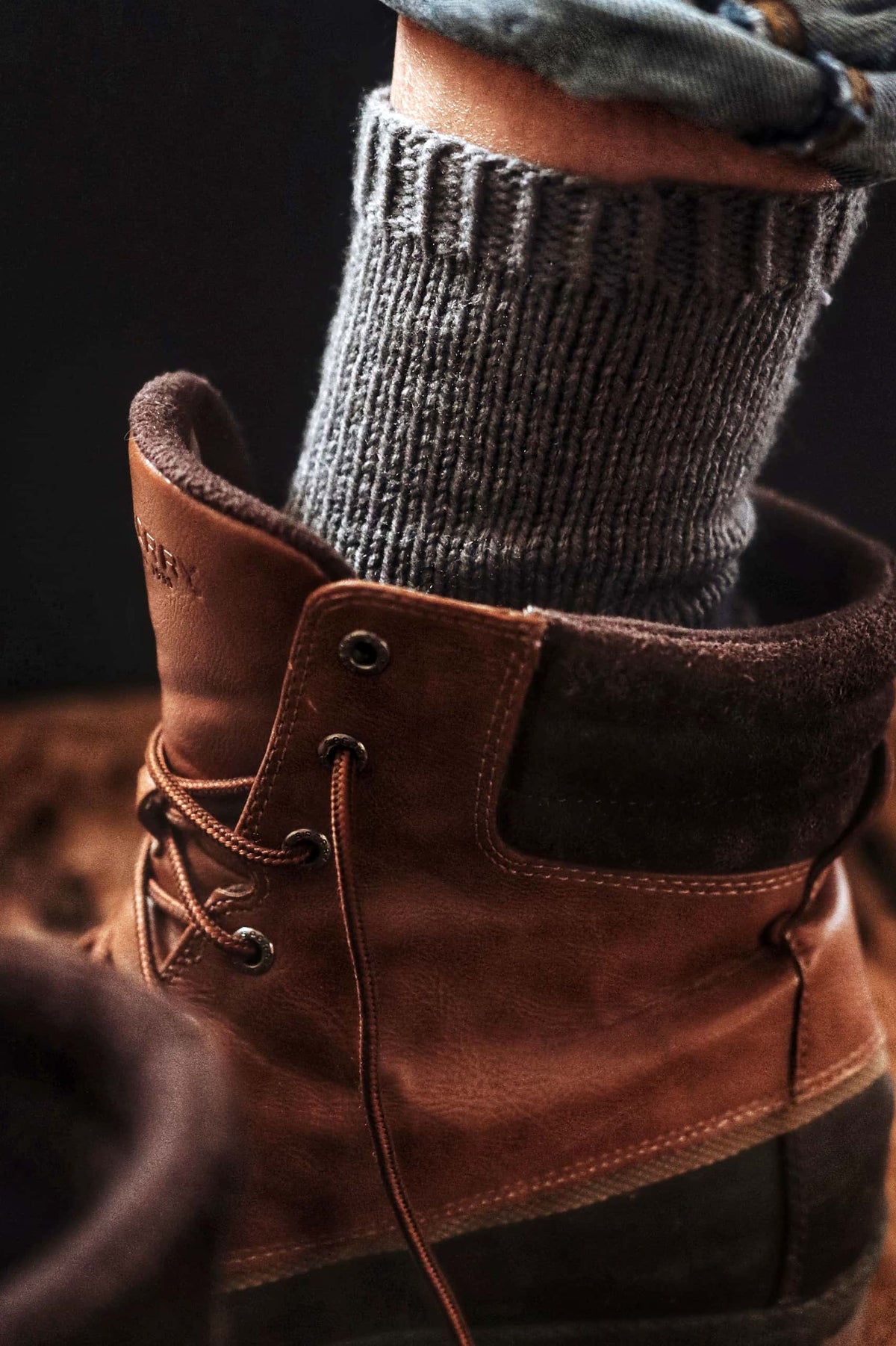 Close up of boyfriend socks knitting pattern showing textured heel detail and comfortable fit