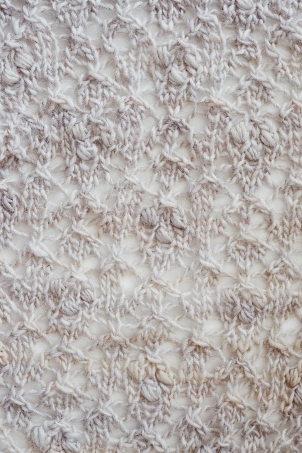 Feminine lace shawl with intricate Estonian knitting details