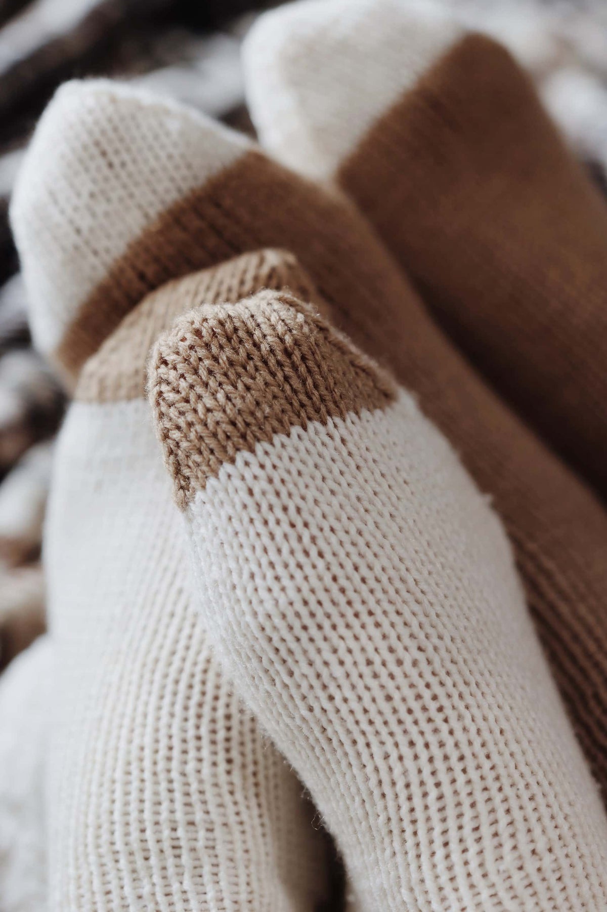 Cozy hand knit cabin socks pattern in neutral tones perfect for men or women