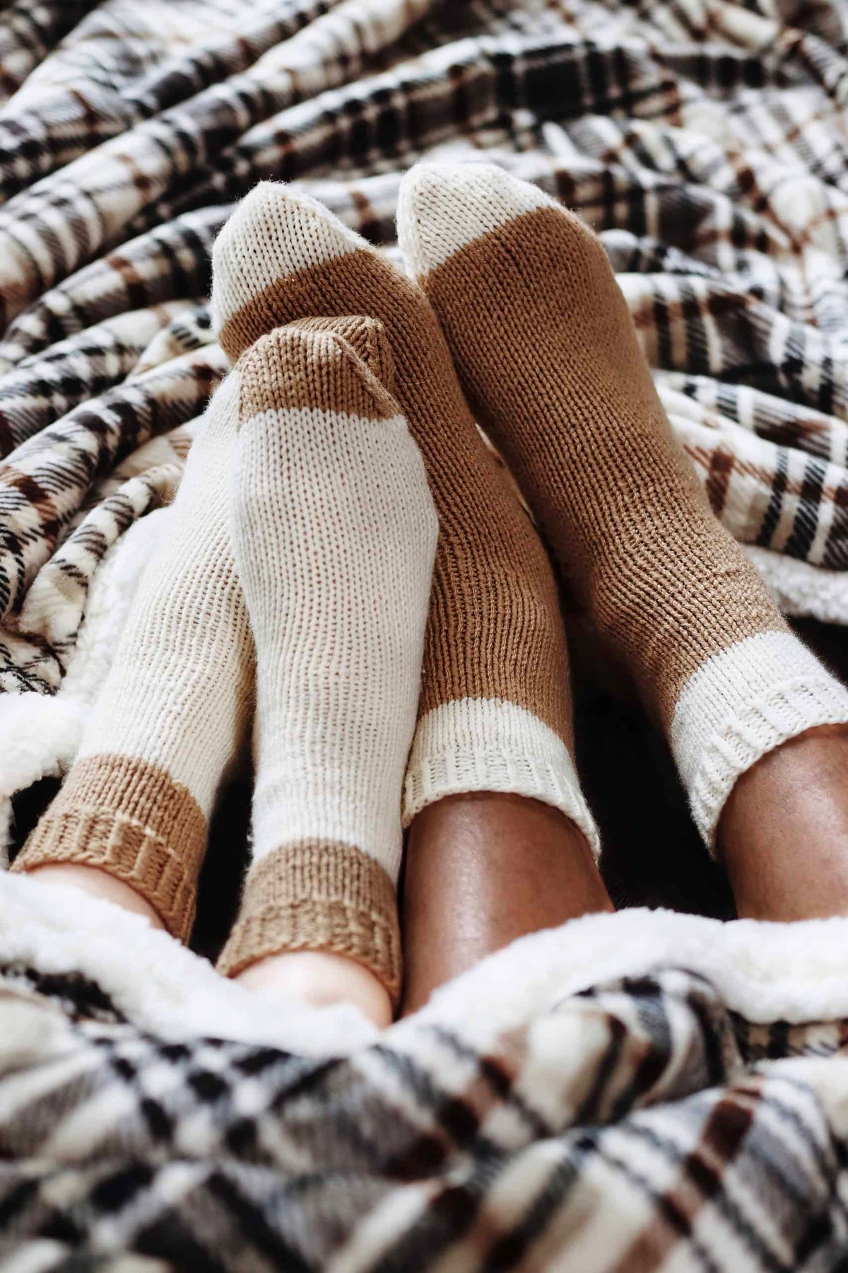 Close up detail of cabin socks knitting pattern showing ribbed cuff and heel construction
