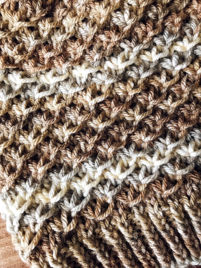 Close up of Sycamore beanie textured stitch pattern detail in cream yarn