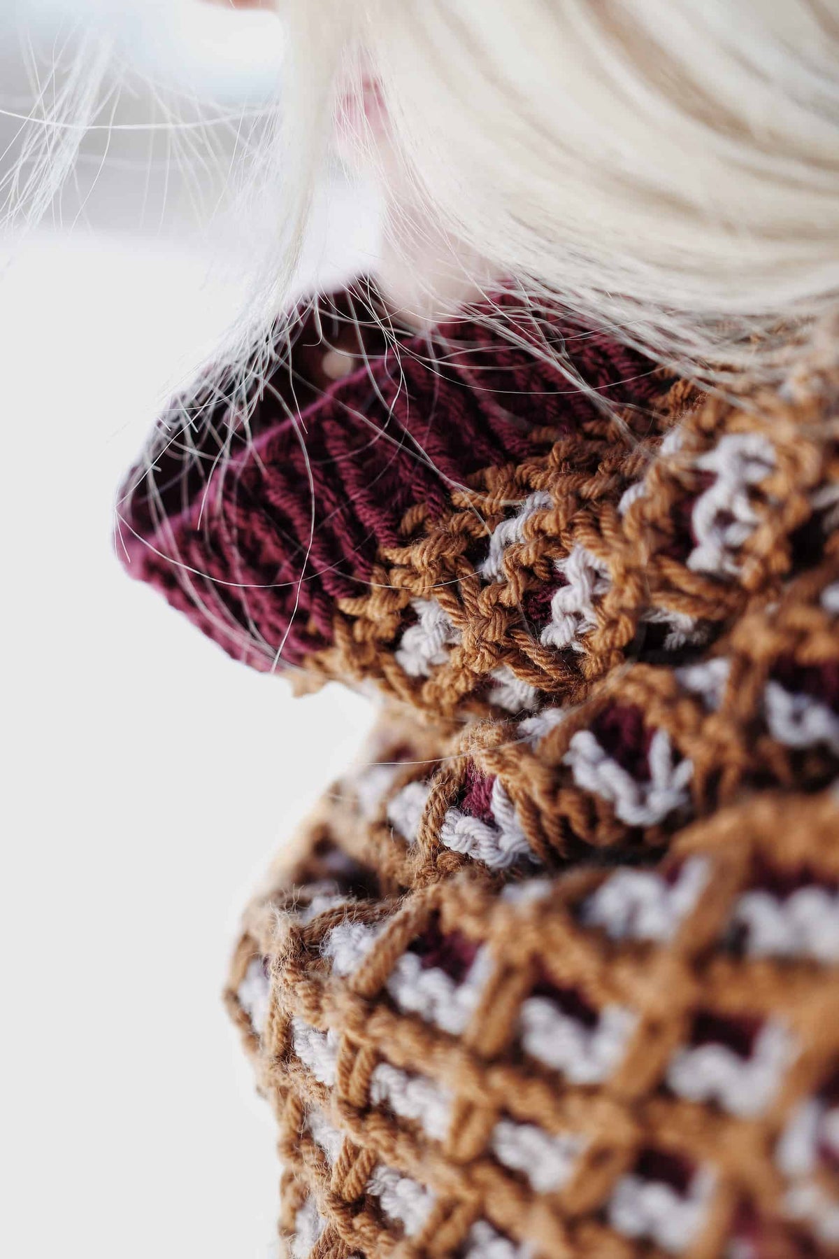 The Horizon Cowl knit pattern draped to show split hem feature and mosaic stitch detail