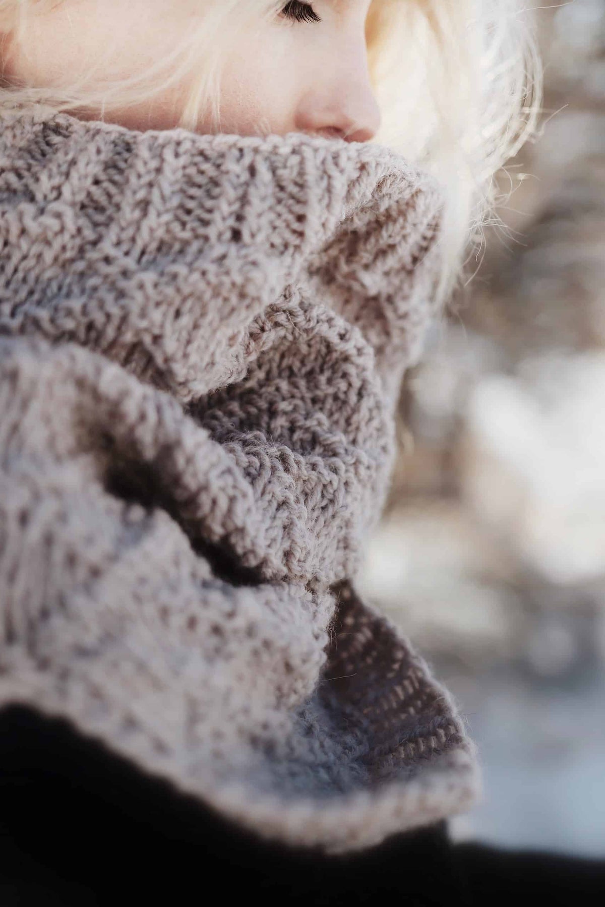 Side view of The Harbor Cowl knitting pattern displaying unique split hem feature