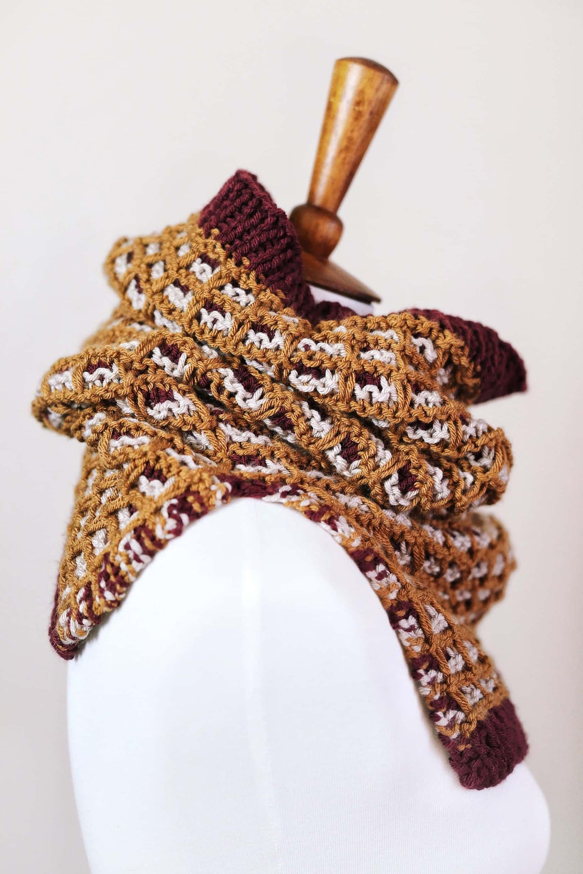 Close-up of mosaic colorwork texture on The Horizon Cowl knitting pattern showing three-color design