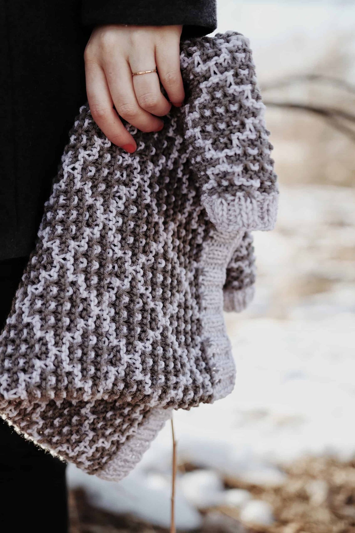 Neutral toned mosaic cowl knitting pattern styled with minimalist aesthetic