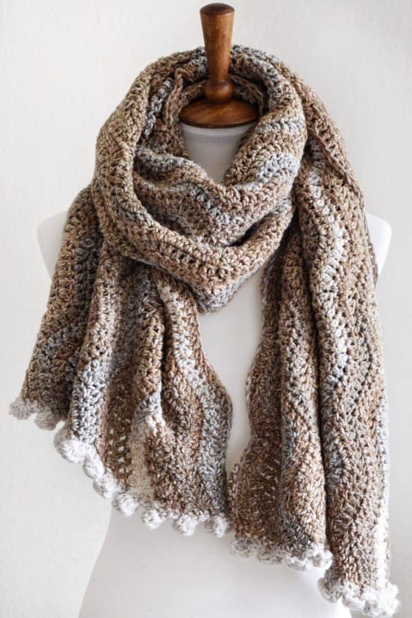 Detail of bobble edge crochet scarf pattern showing textured border and earth tone color transitions