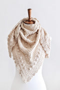 Woman wearing cream lace triangle scarf with bobble details - Isla Scarf crochet pattern by Darling Jadore