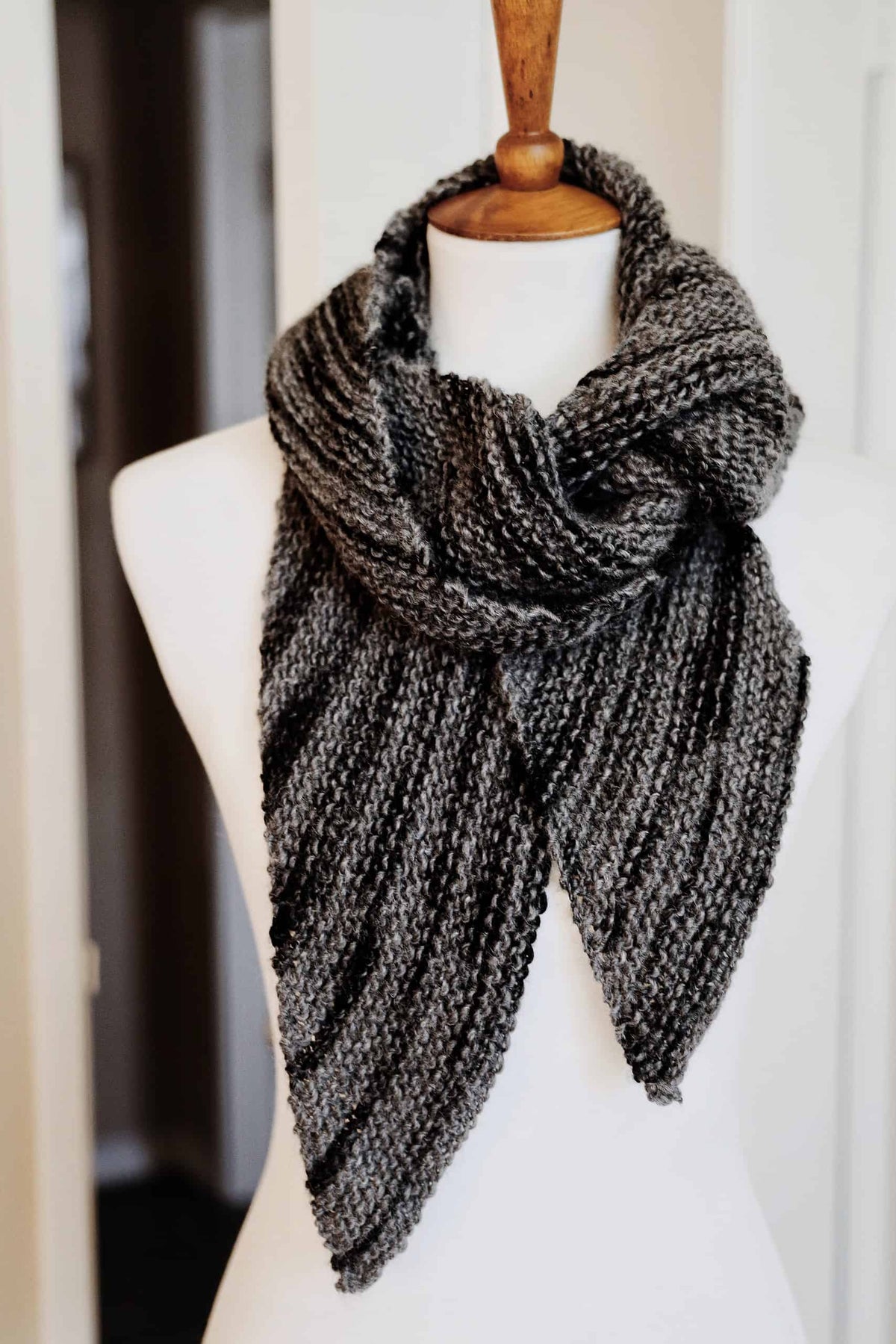 Close up of diagonal bias knit scarf texture in neutral yarn