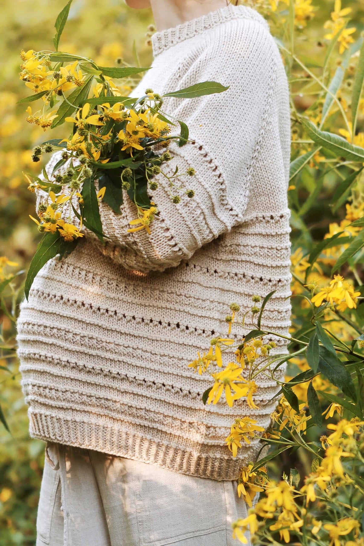 Cream textured knit sweater with yellow wildflowers - The Countryside Sweater Knitting Pattern by Darling Jadore