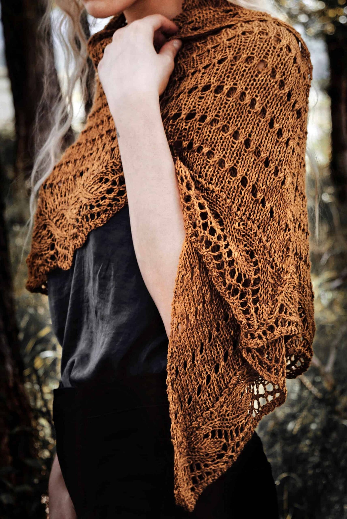 Mustard yellow Ruska lace shawl draped elegantly showing eyelet lace detail and wave border